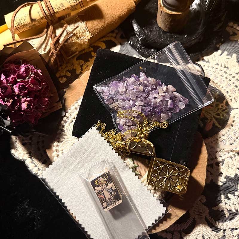Mini art card locket necklace displayed with a free pack of raw crystals
