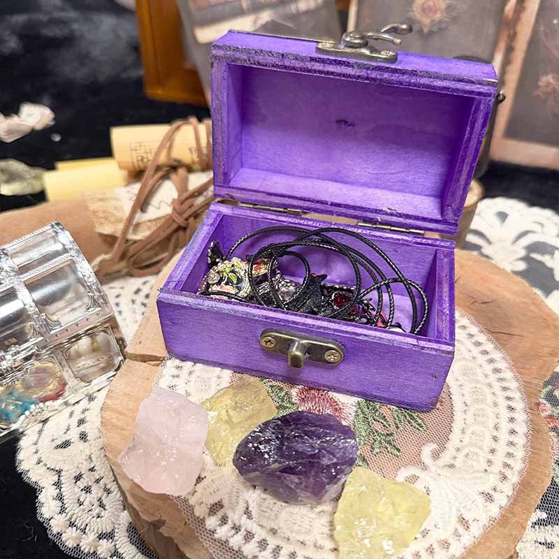 Mini purple jewelry storage box with vintage styled lid and clasps