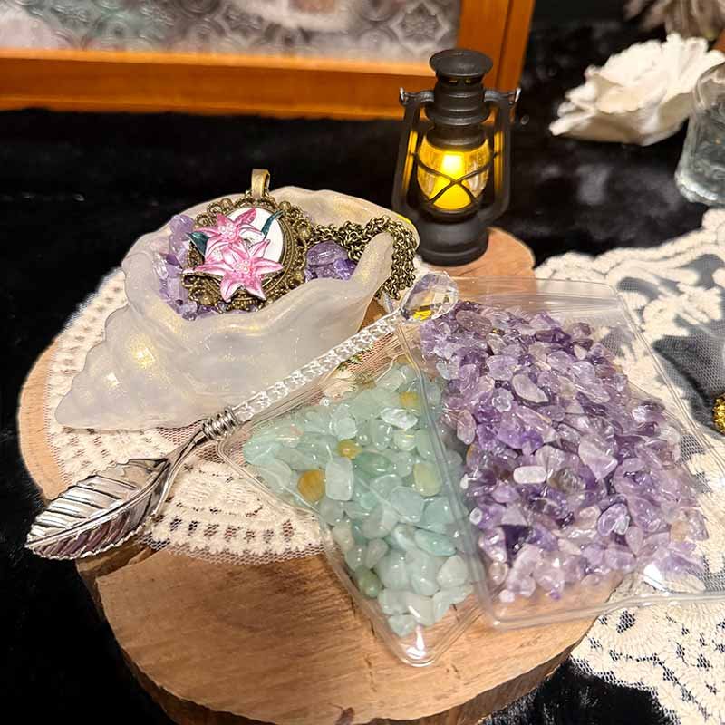 Seashell jewelry care kit with iridescent bowl, vintage spoon, and raw gemstone chips