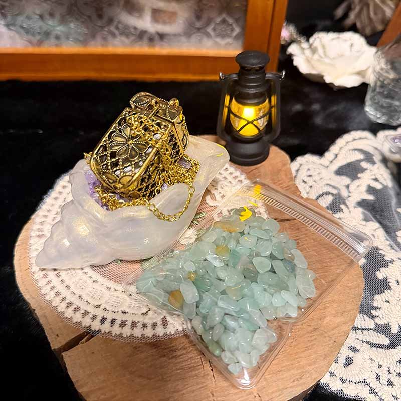 Close-up of iridescent seashell jewelry bowl and vintage leaf spoon