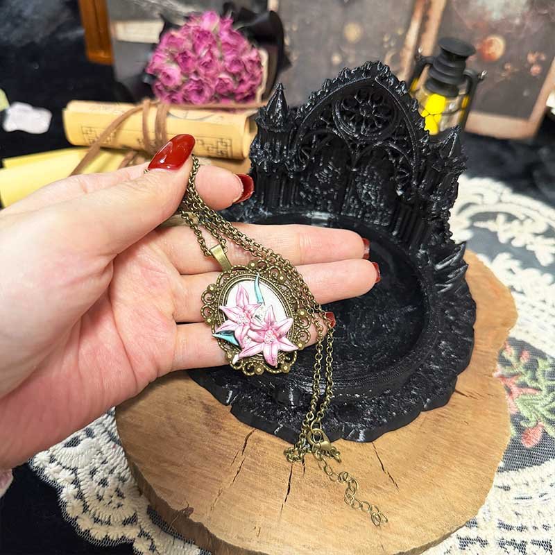 Vintage botanical lily necklace worn with layered outfits feminine gothic jewelry